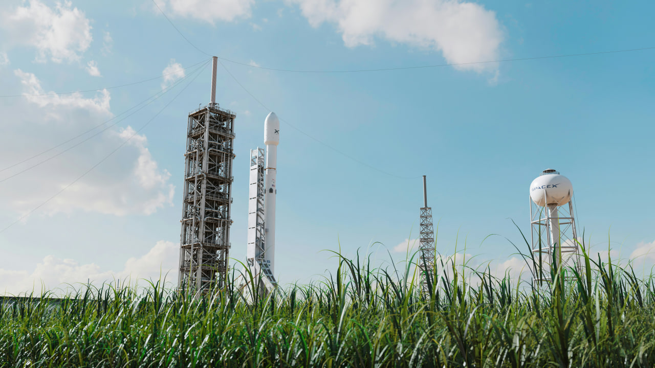 SpaceX rocket on launch pad under blue sky